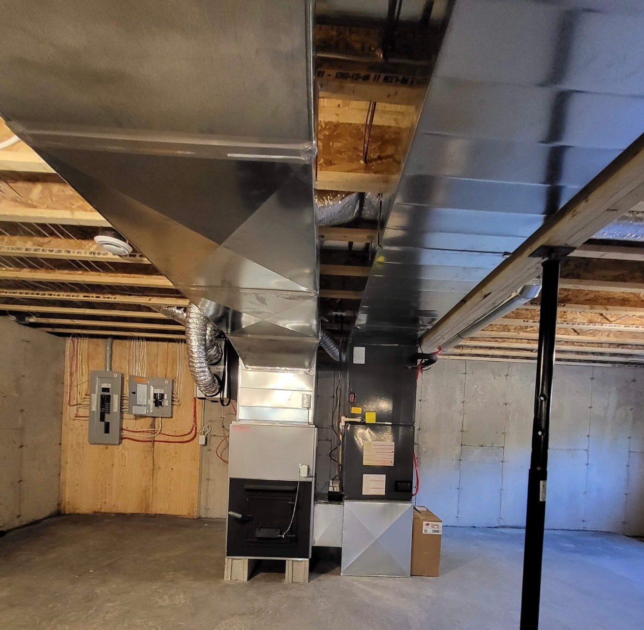 Custom sheet metal ductwork close-up — basement installation