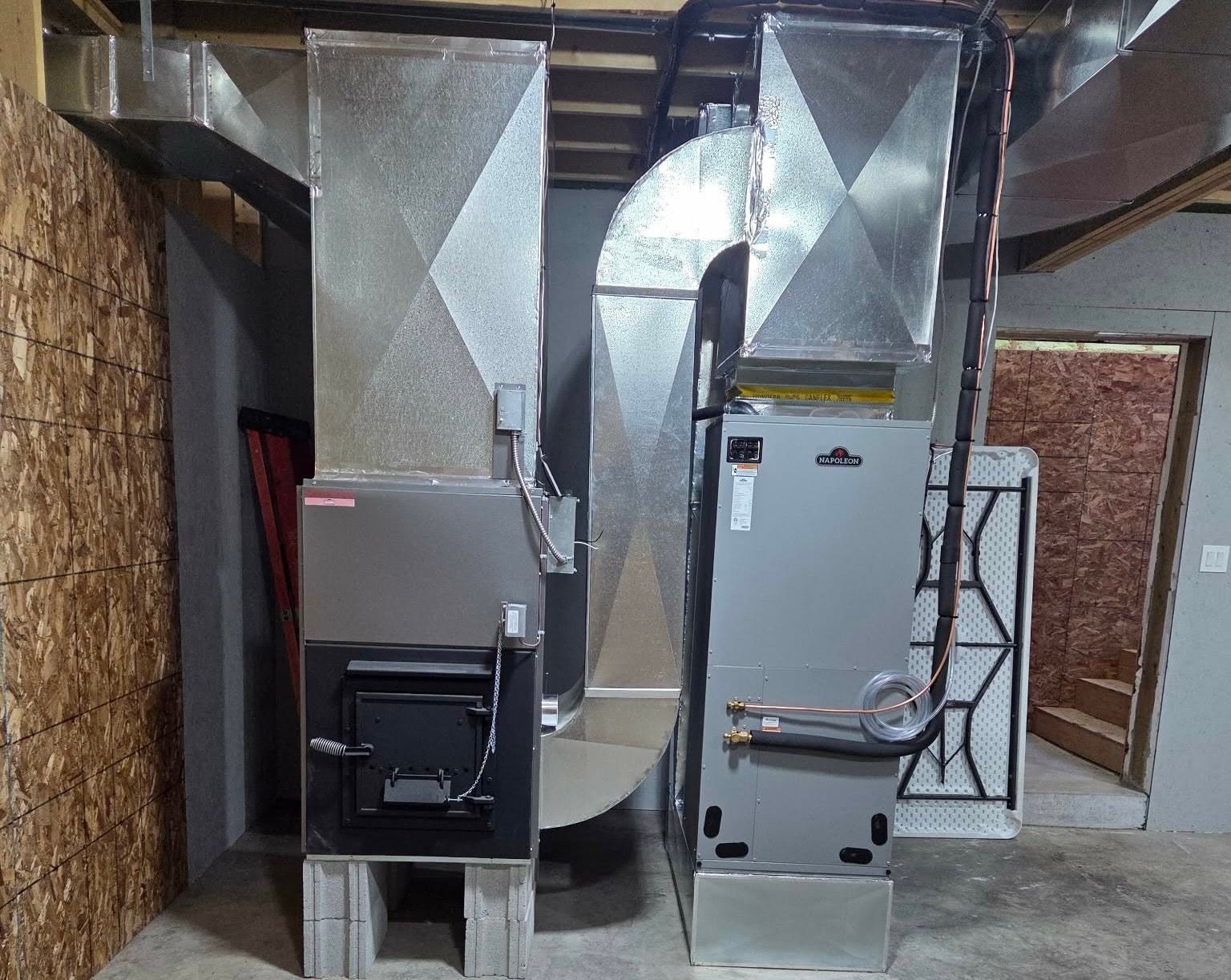 Custom ductwork installation running through residential basement ceiling