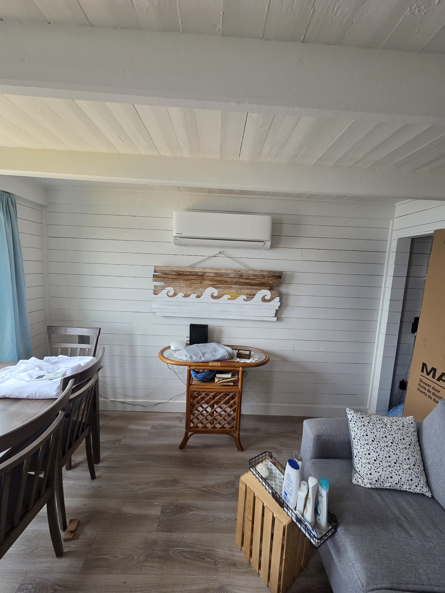 Mini split indoor head unit installed in modern coastal kitchen with ocean view