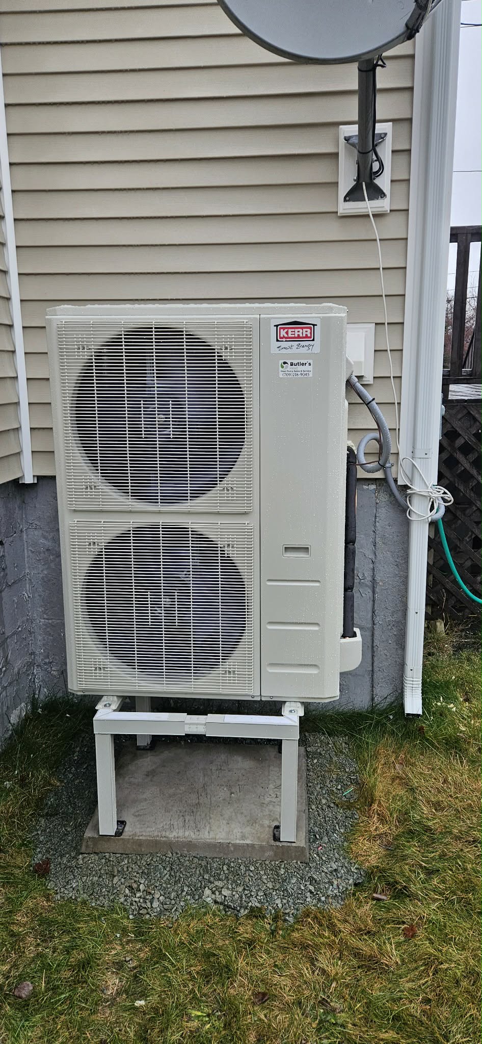 Butler's HVAC Kerr outdoor unit installed on beige siding home