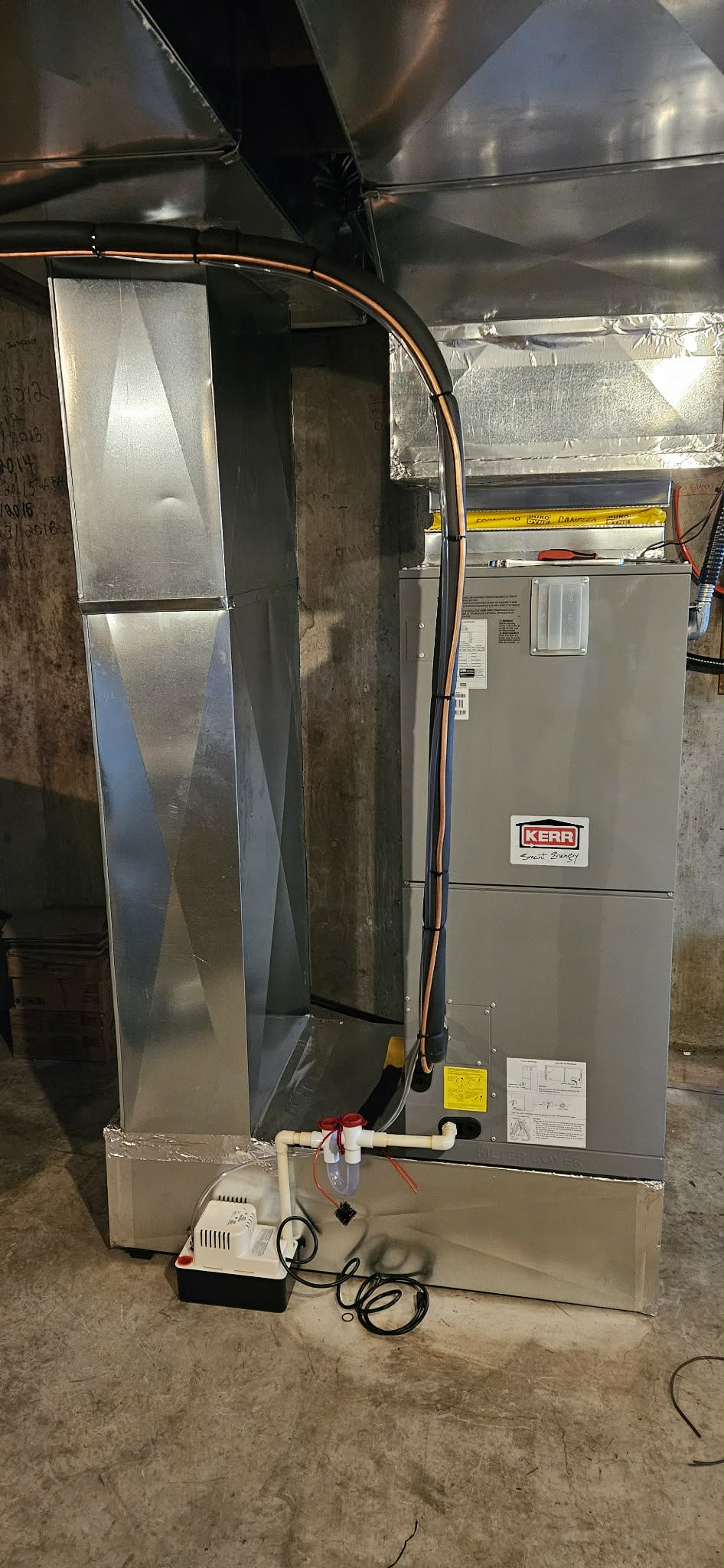 Kerr central heat pump with custom ductwork in basement