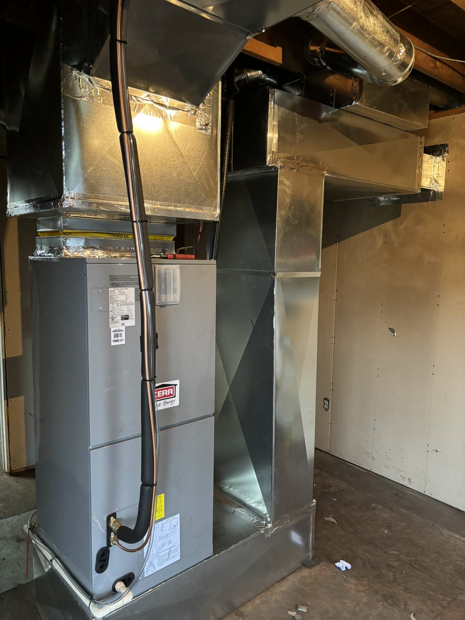 Central heat pump air handler with ductwork — basement installation